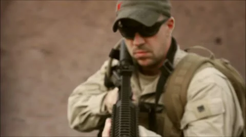 Special Operations Soldier fires weapon at camera (HD) C Stock Footage 8649488
