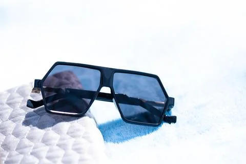 Special Oversized sunglasses model with flat black lenses and black frame shoot Stock Photos
