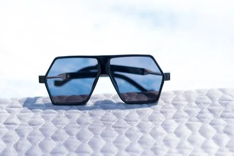 Special Oversized sunglasses model with flat black lenses and black frame shoot Stock Photos
