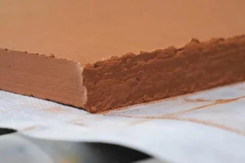 Special red clay mixture for creating decorative panels Stockfoto's