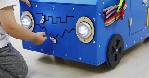 A special toy car model with many functions for the development of fine motor Stockbeeldmateriaal 110281575