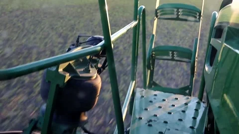 A special tractor sprays the fields from weeds, spraying the fields close-up. Stock Footage 242192616