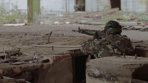 A special unit soldier runs and takes cover. Military operation. Shooting Stock Footage 126027573