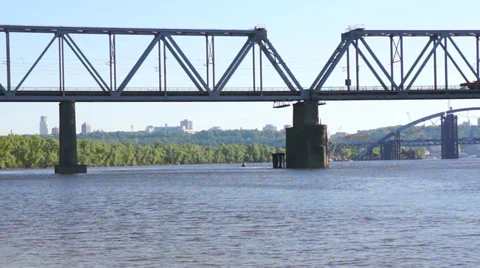 Special wagon of train moves across the river over the bridge. Stock-Footage 37874539