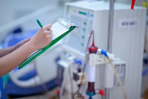 The specialist are checking continuous renal replacement therapy equipment an Stock Photos