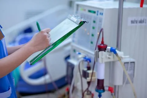 The specialist are checking continuous renal replacement therapy equipment an Stock Photos