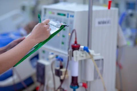 The specialist are checking continuous renal replacement therapy equipment an Stock Photos
