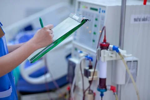 The specialist are checking continuous renal replacement therapy equipment an Stock Photos