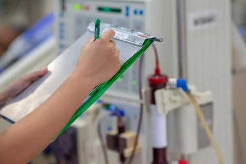 The specialist are checking continuous renal replacement therapy equipment an Stock Photos