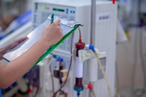 The specialist are checking continuous renal replacement therapy equipment an Stock Photos