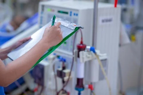 The specialist are checking continuous renal replacement therapy equipment an Stock Photos