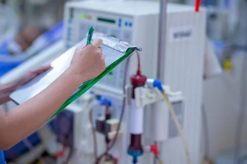 The specialist are checking continuous renal replacement therapy equipment an Stock Photos