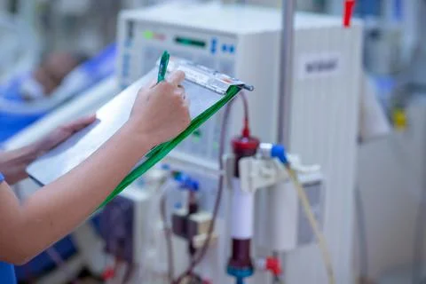 The specialist are checking continuous renal replacement therapy equipment an Stock Photos