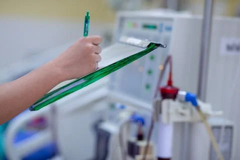 The specialist are checking continuous renal replacement therapy equipment an Stock Photos