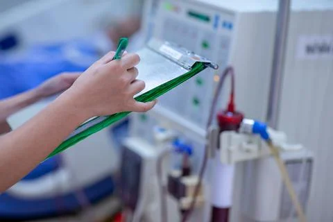 The specialist are checking continuous renal replacement therapy equipment an Stock Photos