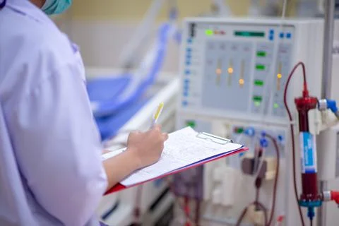 The specialist are checking continuous renal replacement therapy equipment an Stock Photos