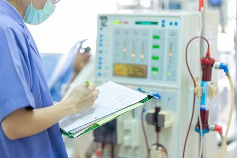 The specialist are checking continuous renal replacement therapy equipment an Stock Photos