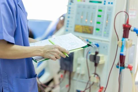 The specialist are checking continuous renal replacement therapy equipment an Stock Photos