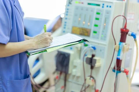 The specialist are checking continuous renal replacement therapy equipment an Stock Photos