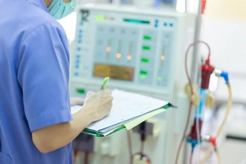 The specialist are checking continuous renal replacement therapy equipment an Stock Photos