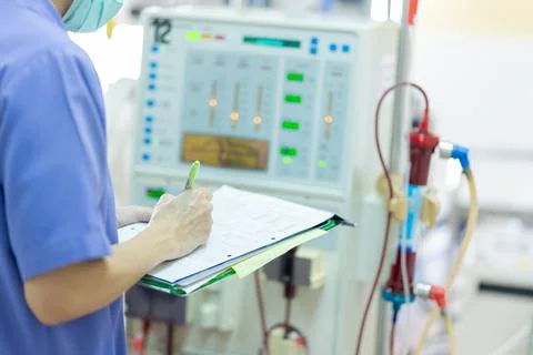 The specialist are checking continuous renal replacement therapy equipment an Stock Photos