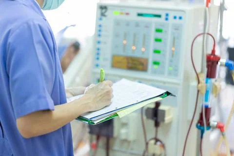 The specialist are checking continuous renal replacement therapy equipment an Stock Photos