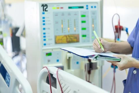 The specialist are checking continuous renal replacement therapy equipment an Stock Photos