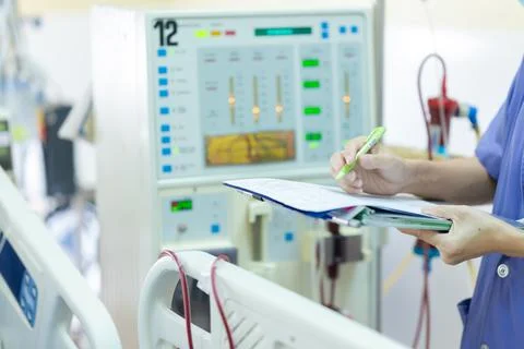 The specialist are checking continuous renal replacement therapy equipment an Stock Photos