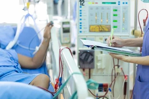 The specialist are checking continuous renal replacement therapy equipment an Stock Photos