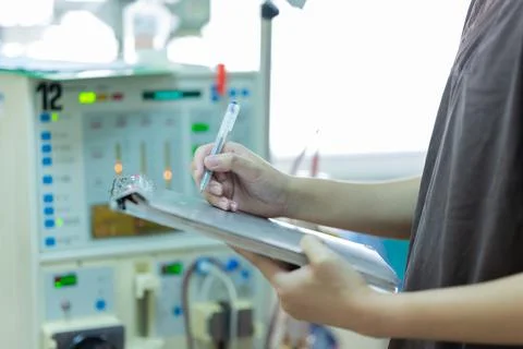 The specialist are checking continuous renal replacement therapy equipment an Stock Photos