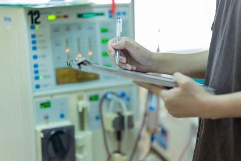 The specialist are checking continuous renal replacement therapy equipment an Stock Photos