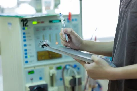 The specialist are checking continuous renal replacement therapy equipment an Stock Photos