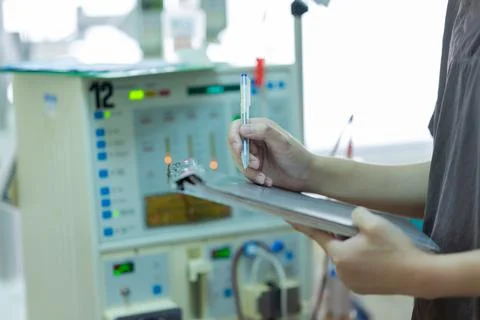 The specialist are checking continuous renal replacement therapy equipment an Stock Photos
