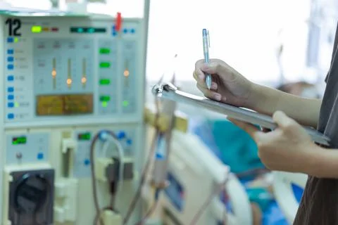 The specialist are checking continuous renal replacement therapy equipment an Stock Photos