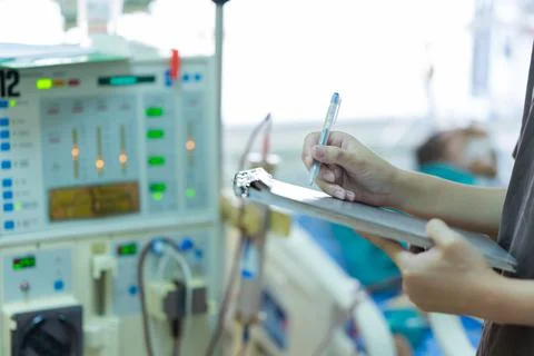 The specialist are checking continuous renal replacement therapy equipment an Stock Photos
