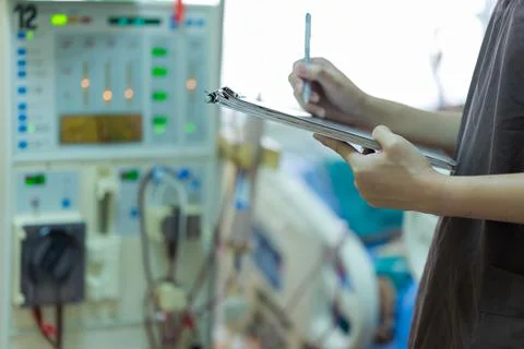 The specialist are checking continuous renal replacement therapy equipment an Stock Photos