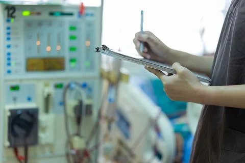 The specialist are checking continuous renal replacement therapy equipment an Stock Photos