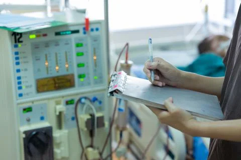 The specialist are checking continuous renal replacement therapy equipment an Stock Photos