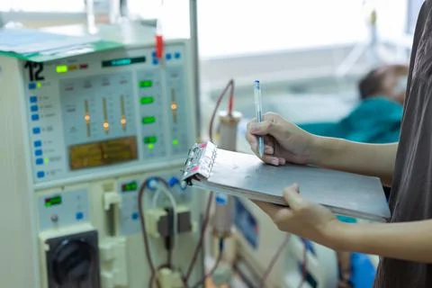 The specialist are checking continuous renal replacement therapy equipment an Stock Photos