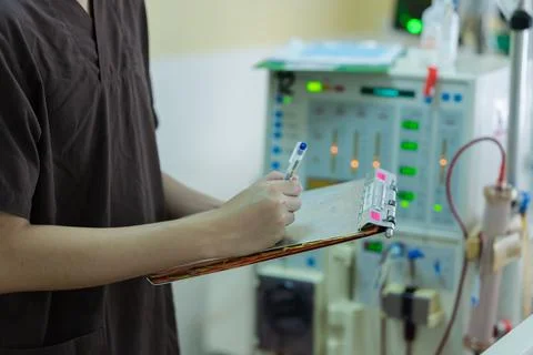 The specialist are checking continuous renal replacement therapy equipment an Stock Photos