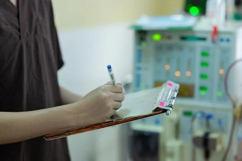 The specialist are checking continuous renal replacement therapy equipment an Stock Photos