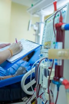 The specialist are checking continuous renal replacement therapy equipment an Stock Photos