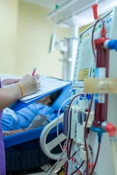 The specialist are checking continuous renal replacement therapy equipment an Stock Photos