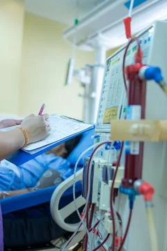 The specialist are checking continuous renal replacement therapy equipment an Stock Photos