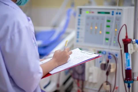 The specialist are checking continuous renal replacement therapy equipment an Stock Photos