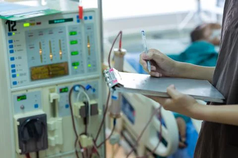 The specialist are checking continuous renal replacement therapy equipment an Stock Photos