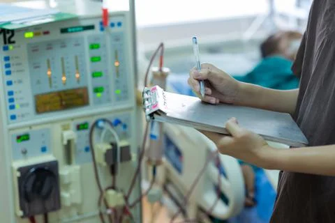 The specialist are checking continuous renal replacement therapy equipment an Stock Photos
