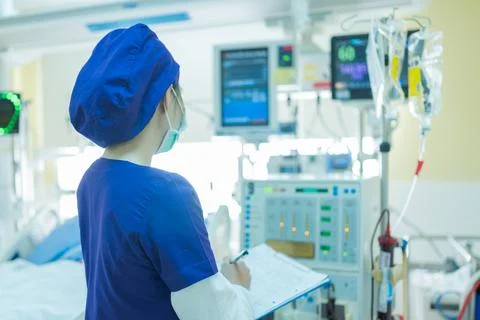 The specialist are checking continuous renal replacement therapy equipment. Stock Photos