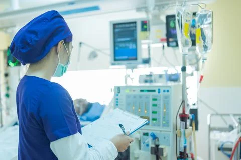 The specialist are checking continuous renal replacement therapy equipment. Stock Photos