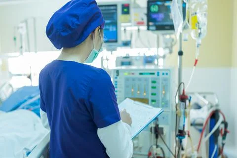 The specialist are checking continuous renal replacement therapy equipment. Stock Photos